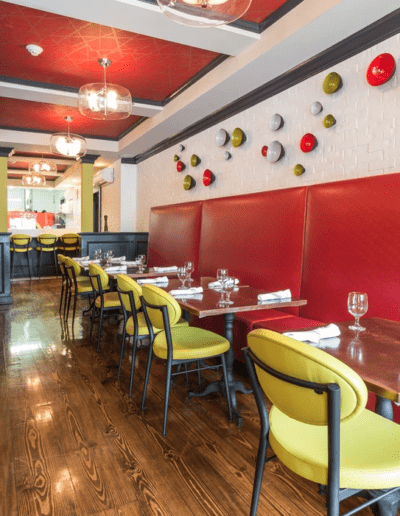 A restaurant with red and yellow walls.