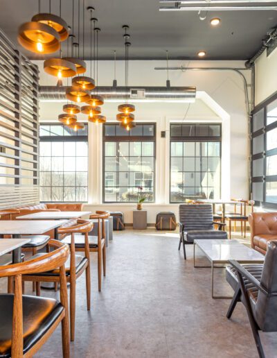 The interior of a restaurant with tables and chairs.